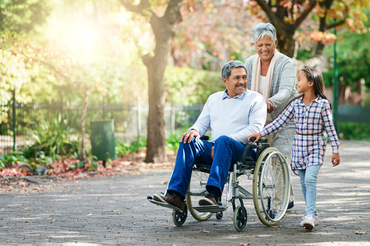 wheelchair-bound man with family