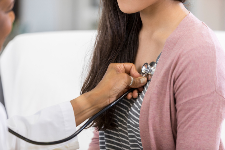 doctor listening to patient's heart