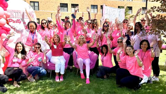 Group of women in pink celebrate