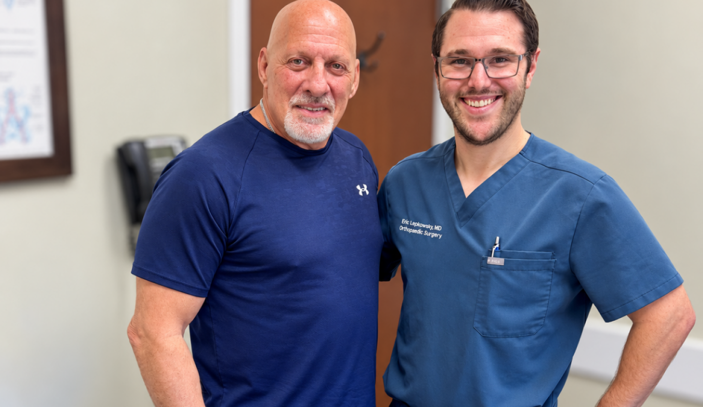 Patient and Dr. Lepkowsky pose together 