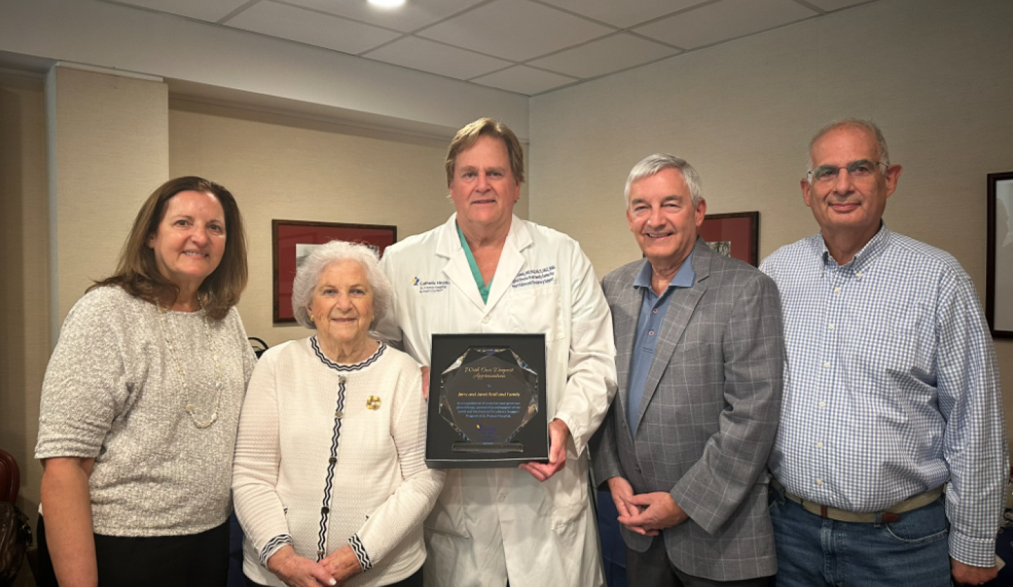 Janet Kroll (second from left) and family are honored by Edward Lundy, MD (third from left), Surgical Director of the Kroll Family Center for Heart Failure and Circulatory Support, on the 10th anniversary of the center being established with the family’s support at St. Francis Hospital. 