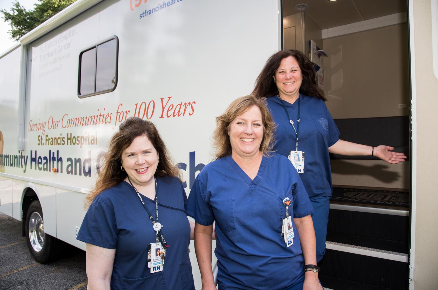St. Francis Hospital staff in front of community van