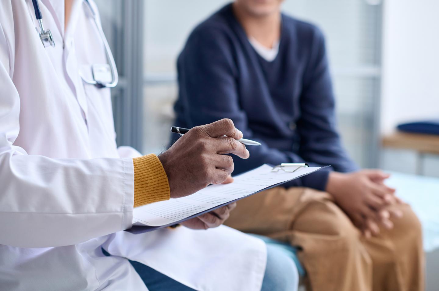 Physician sitting with a patient