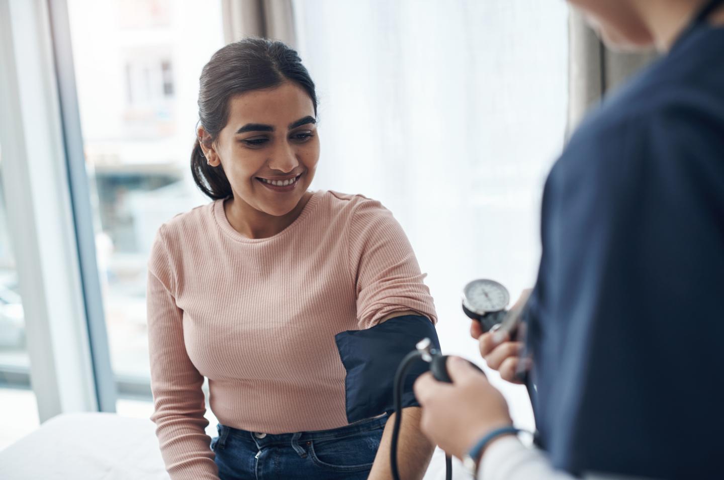 Female getting her blood pressure taken