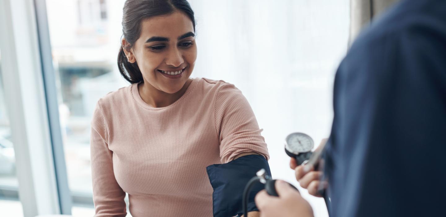 Female having blood pressure taken