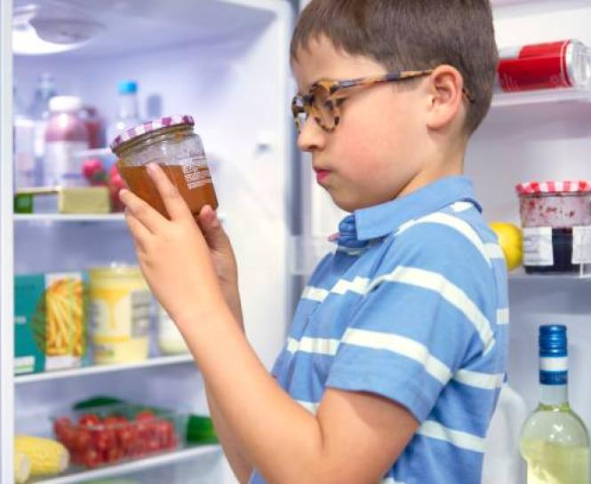 Boy reading label