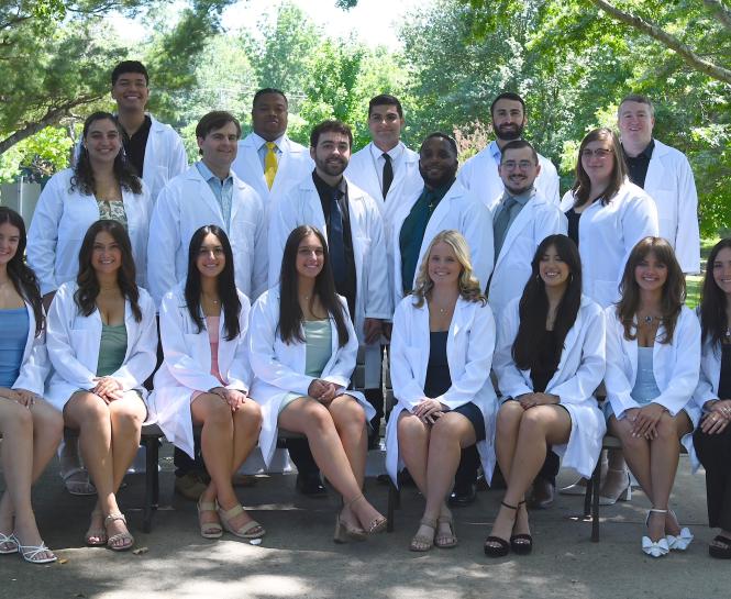 Students in White Lab Coats for the Mercy Hospital School of Radiology Class of 2026 Group Photo