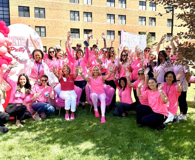Group of women in pink celebrate