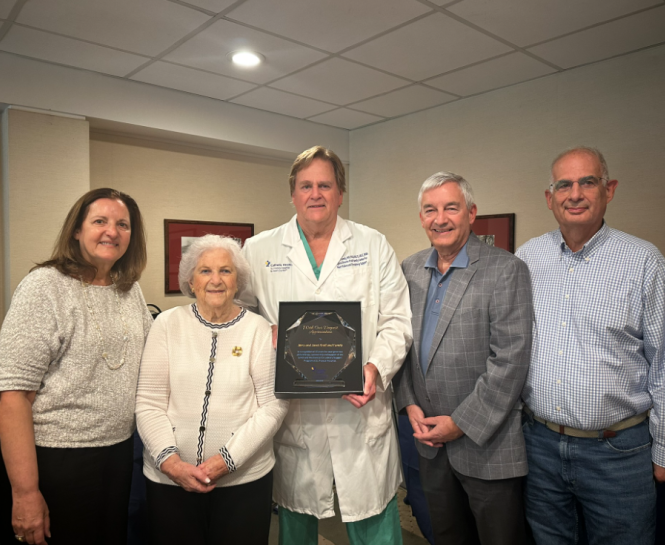 Janet Kroll (second from left) and family are honored by Edward Lundy, MD (third from left), Surgical Director of the Kroll Family Center for Heart Failure and Circulatory Support, on the 10th anniversary of the center being established with the family’s support at St. Francis Hospital. 