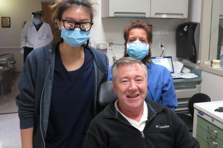 Patient Kevin Magrane with staff at St. Charles Hospital's Stephen B. Gold Dental Clinic