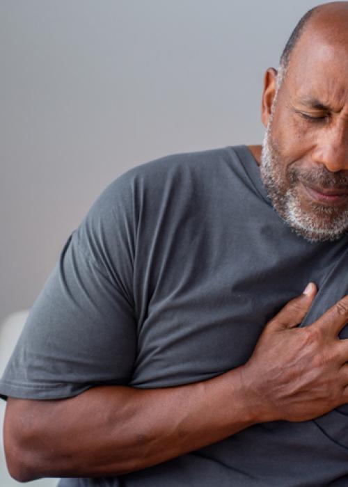 man experiencing chest discomfort