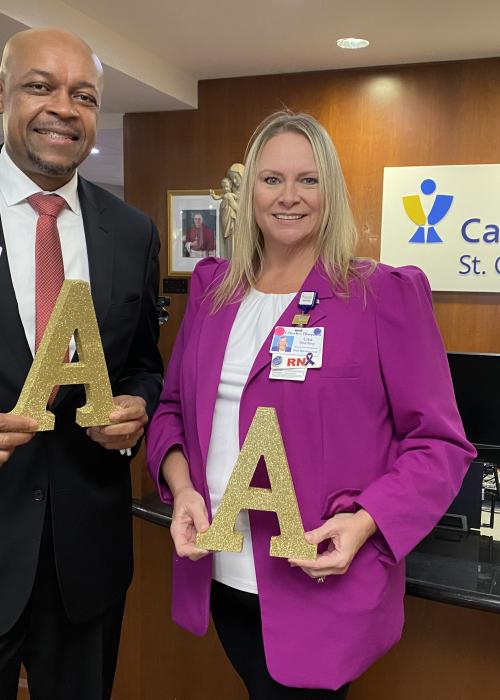 St. Charles staff hold letter A