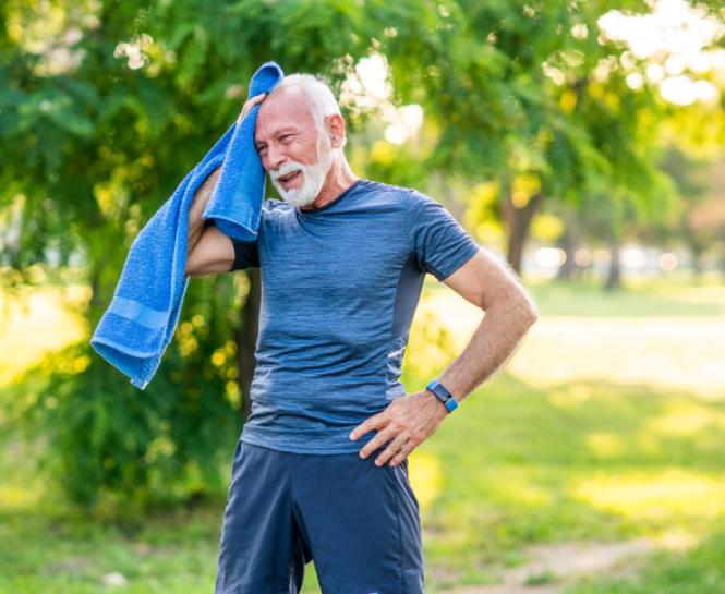 man cooling down with towel