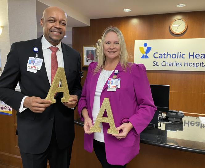 St. Charles staff hold letter A